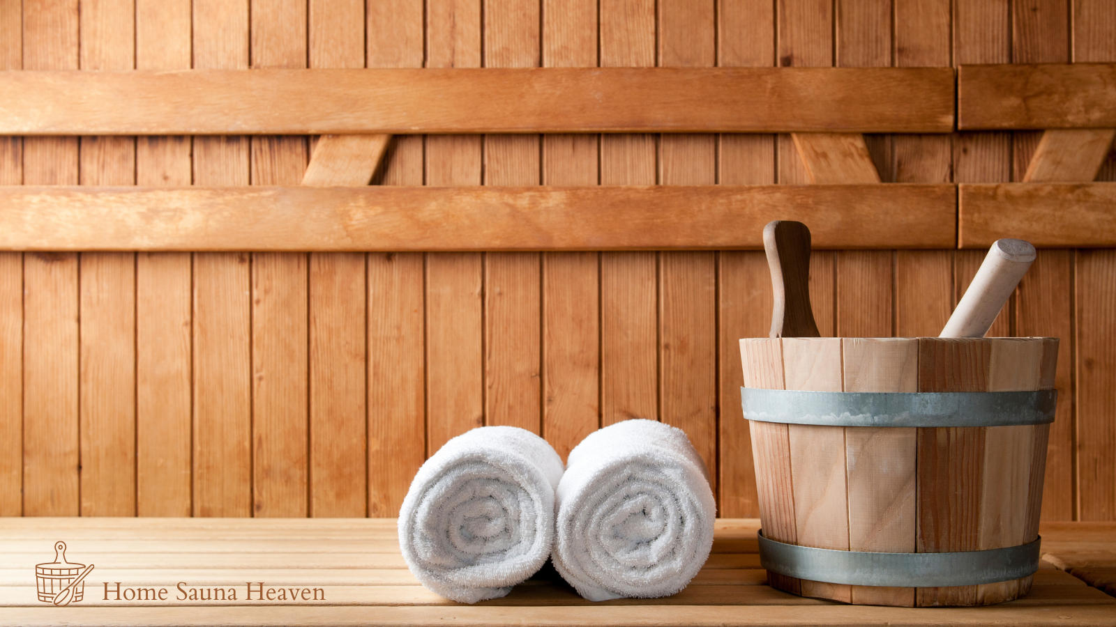 sauna bucket and towels inside a sauna