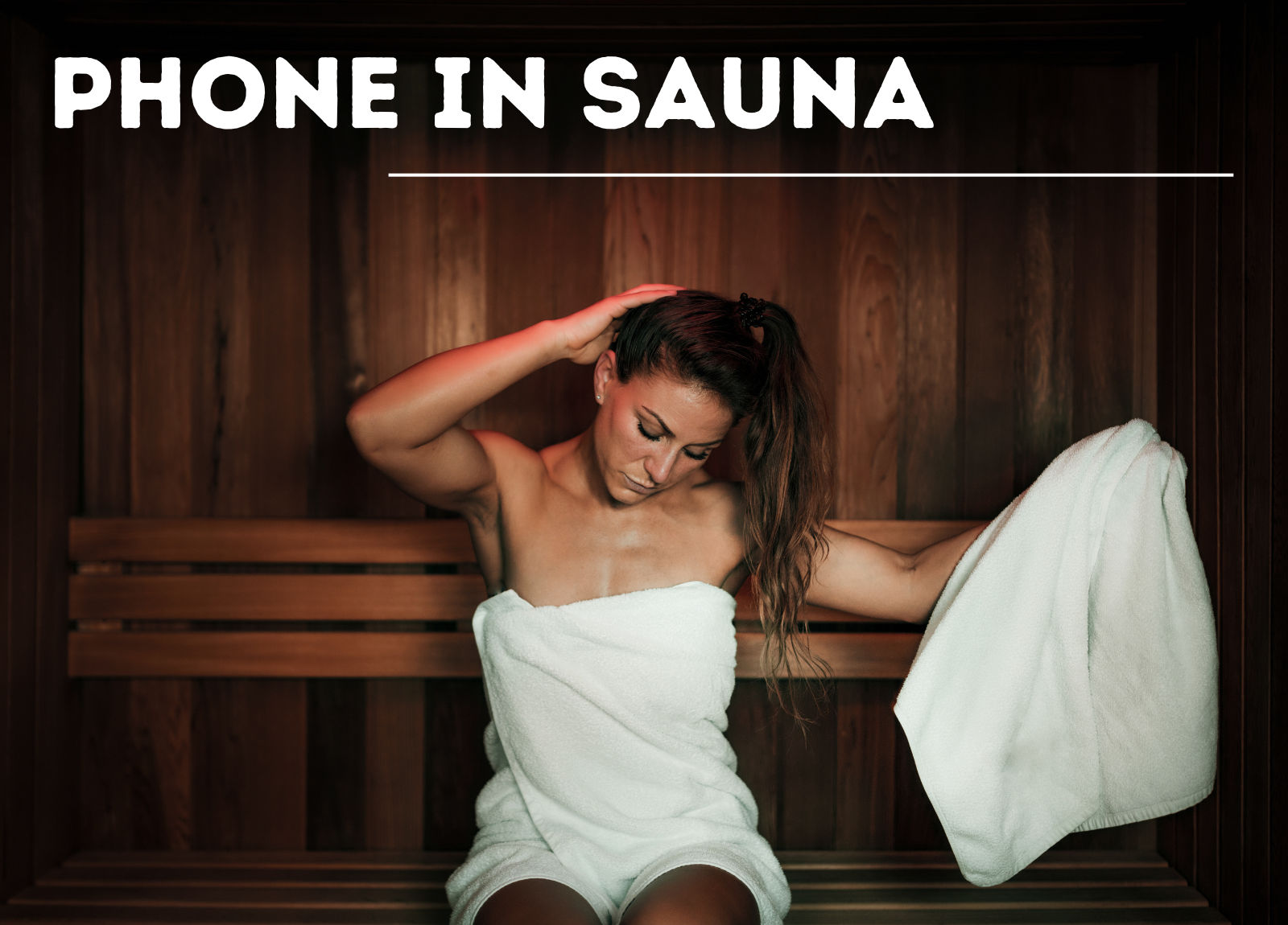 woman sitting in a sauna with a white towel