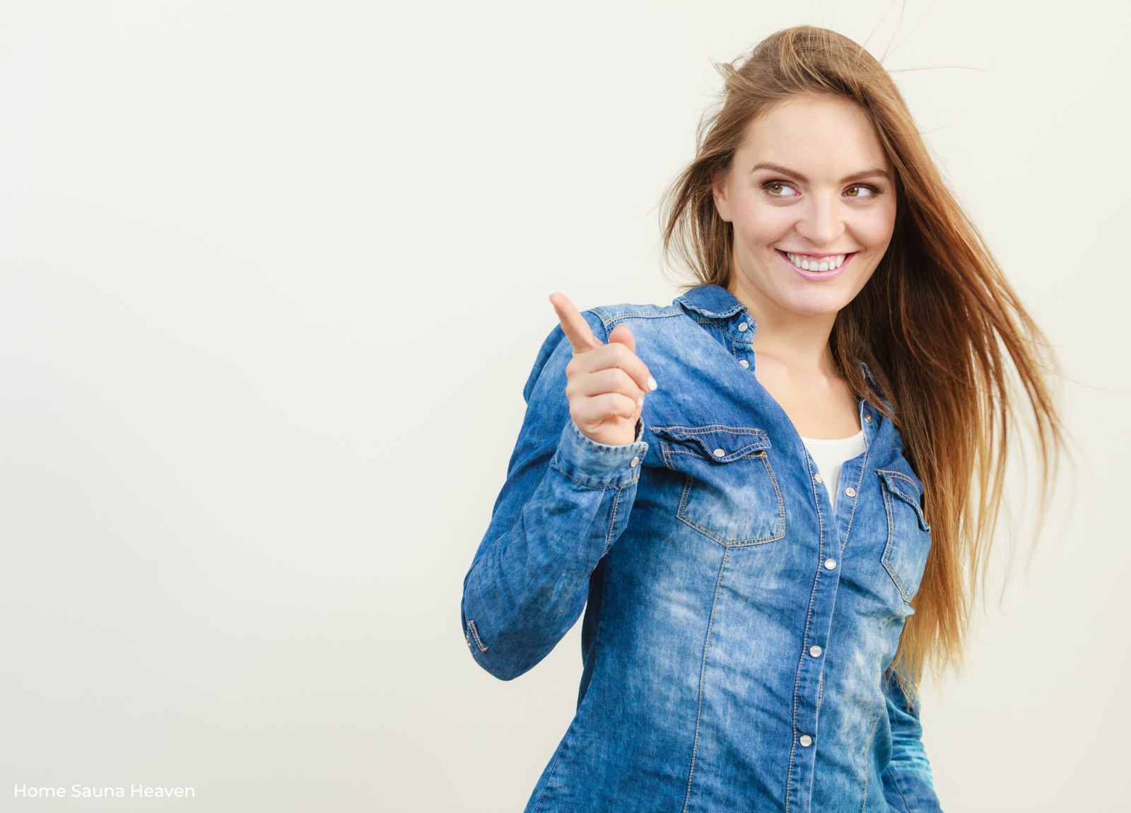woman making hand gesture and smiling