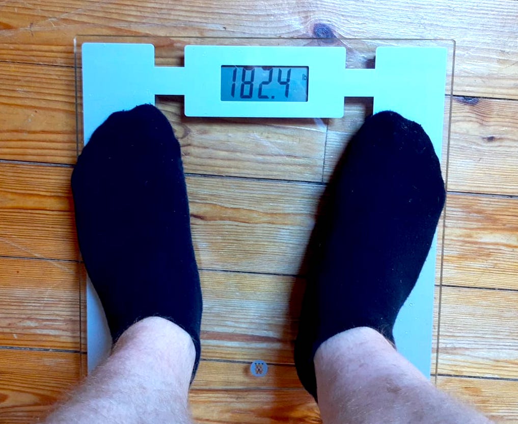 measuring weight on weighing scales before sauna blanket session - phase 2
