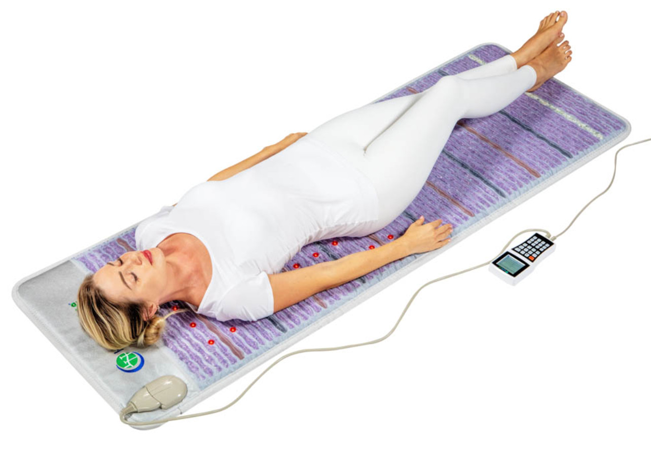 woman laying on a healthyline pro infrared mat